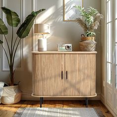 a living room with a plant on top of a wooden cabinet next to a window