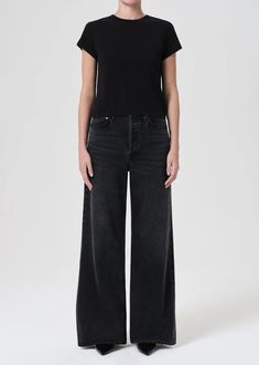 Our Dame Jean, featuring a waist accentuating high-rise, a relaxed cut through the hips and a wide leg. Create an ultra-flattering silhouette by styling it with a sleek tee. Hitch Intended to have a relaxed fit. For a higher, closer fit, we recommend sizing down. Looks Like: Lived-in washed black with subtle whiskering and fading and a finished hemFeels Like: Non-stretch Regenerative cotton that offers a luxurious drape for all-day movement Closure: Button Fly Rise: 12 1/2" Inseam: 32 1/2" Leg O Luxury Wide-leg Relaxed Fit Jeans, Luxury High Rise Relaxed Fit Jeans, Luxury Washed Black Fitted Jeans, Luxury Stretch Black Jeans, Luxury High Waist Black Jeans, Luxury High-rise Faded Jeans, Luxury Relaxed Fit Jeans, Luxury High Rise Faded Jeans, Luxury Washed Black Jeans