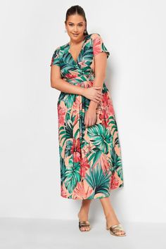 Shop YOURS Curve Green & Peach Tropical Floral Print Wrap Dress at Yours Clothing. Discover women’s plus size clothing in sizes 10-36 with fast delivery. Elegant Wedding Guest Dress, Tropical Fashion, Plus Swimwear, Tropical Floral Print, African Clothing Styles, Printed Wrap Dresses, Midi Dress Casual, Tropical Floral, Floral Print Dress