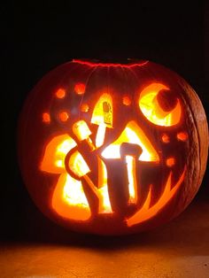 a pumpkin carved to look like it has the letter t on it