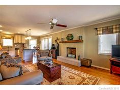 a living room filled with furniture and a flat screen tv