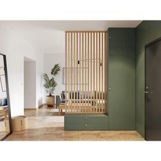 a room with green walls and wooden slats