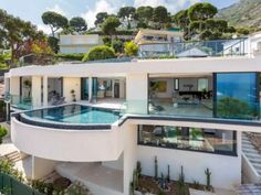 an aerial view of a house with a swimming pool