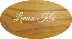 a wooden sign with the words lemon kiss on it's front and back side