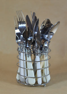 there are forks and spoons in the holder