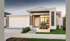 a modern house with grass in the front yard