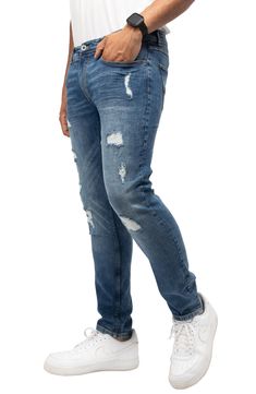 Whiskered and distressed, these modern skinny jeans cut from cotton denim with a kiss of stretch will give your look a touch of edge. Zip fly with button closure 99% cotton, 1% elastane Machine wash, tumble dry Imported 
 Model stats: 6'1" height, 32" waist. Model is wearing size 32. Distressed Slim Fit Cotton Jeans, Distressed Slim Fit Jeans, Slim Fit Distressed Cotton Jeans, A Kiss, Nordstrom Rack, Kiss, Nordstrom, How To Wear