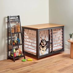 a dog sitting in its kennel next to a shelf with food and toys on it