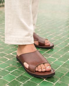 Step into comfort and style with our handmade leather sandals for men, expertly crafted by Moroccan artisans. Made from 100% genuine leather, these sandals are designed for durability and everyday wear. The slip-on design makes them easy to wear, perfect for casual summer days or as comfortable travel shoes. Key Features: Handcrafted in Morocco using traditional techniques 100% genuine leather  Slip-on style for convenience Available in multiple sizes 40 to 45 europian size  Perfect for summer, casual outings, and travel Ideal gift for birthdays, Father's Day, or special occasions Care Instructions: To ensure longevity, keep the sandals dry and use a leather conditioner periodically to maintain the leather's quality. Support Local Artisans: These sandals are made in collaboration with skil Mens Leather Sandals Handmade, Comfortable Travel Shoes, Mens Sandals Casual, Sandals Comfortable, Mens Shoes Sandals, Leather Sandals Handmade, Mens Leather Sandals, Casual Footwear, Travel Shoes