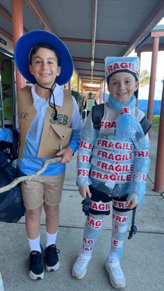 two children dressed up in costumes for halloween