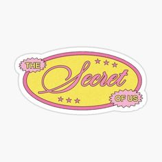 a sticker that says the secret of us with stars in pink and yellow on it