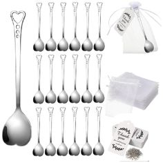 a set of six silver spoons with tags on them and some other items in the background