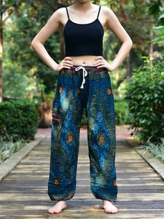 These beautifully crafted trousers are hand made in Thailand. They are constructed from 100% Super Soft Rayon material, that is both lightweight but strong & resilient. This style comes in 2 sizes with a fully elasticated waist designed to fit a broad range of waists, from 20 inches to 46 inches - see size chart for our Small / Medium and Large / X-Large sizes below. Our harem pants will make you feel like you're walking on air because they are constructed from lightweight, super soft and br Festival Straight Pants With Elastic Waistband, Hippie Ankle-length Pants With Elastic Waistband, Wide Leg Yoga Pants With Pockets For Festival, Hippie Festival Pants With Pockets, Loosely Fitted Full Length Bottoms For Festivals, Hippie Bottoms With Elastic Waistband For Festivals, Hippie Bottoms With Pockets For Festivals, Hippie Festival Bottoms With Elastic Waistband, Festival Wide-leg Pants With Elastic Waistband