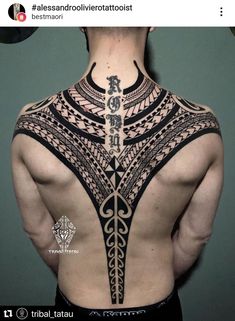 the back of a man's neck with an intricate tattoo design on his chest