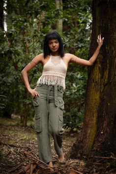 A handmade, boho-inspired piece with intricate crochet detailing and a playful fringed hemline. The halter neck creates a flattering silhouette and leaves the shoulders and upper back open. This versatile top can be styled with shorts for a casual and relaxed look or a flowy skirt or pants for a bohemian vibe. Hand made with Love ❀ The Point Of Life, Point Of Life, Fringe Crop Top, Intricate Crochet, Alan Watts, Crochet Fringe, Silk Bag, Hippie Shirt, Funky Design