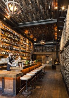 a bar with lots of bottles on the shelves