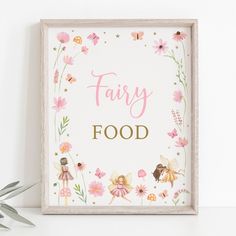 a fairy food sign with pink flowers and tinkerbells in the center, next to a plant