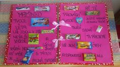 a pink bulletin board with candy bars, candies and other things written on it