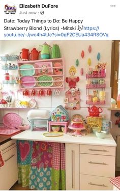 an image of a kitchen with lots of items on the counter and shelves above it