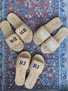 four pairs of personalized espadros laid out on top of a blue rug