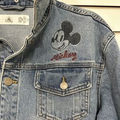 Brand New With Tags. It’s In Perfect Condition With No Flaws. Revived As A Gift But It’s Too Big Mickey Jean Jacket Male/Unisex Size M Disney Long Sleeve Fall Outerwear, Disney Style Long Sleeve Fall Outerwear, Fall Disney Long Sleeve Outerwear, Casual Long Sleeve Mickey Mouse Outerwear, Fall Mickey Mouse Cotton Outerwear, Cotton Mickey Mouse Long Sleeve Outerwear, Football Jeans, Disney Jean Jacket, Christmas Blazer