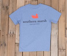 Washed Blue Heather Blue Short Sleeve Top With Back Print, Casual Blue Tops With Back Print, Blue Relaxed Fit Top With Back Print, Silhouette Logo, Southern Marsh, Popular Shirt, Mallard, Lounge Shorts, Pocket Tee