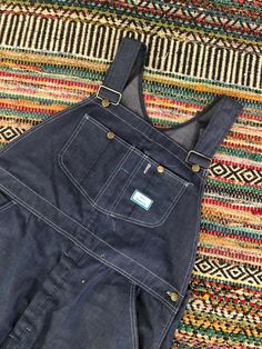 Super dope vintage 1960's overall bibs Sears brand Adjustable straps Soft denim Great vintage condition Paint stains on back rear of overalls. Tag reads size 40w/30 in long Measurements taken flat are Waist: 21 in Hips: 21.5 in Inseam: 28 in Length: 53 in long all sales are final Thanks for checking out Cereal Vintage Thrift Recycle Reuse Recreate Retro Bib Front Overalls With Pockets, Retro Bib Front Overalls In Medium Wash, Vintage Denim Bib Front Shortalls, Vintage Denim Shortalls With Bib Front, Retro Medium Wash Bib Front Overalls, Retro Dark Wash Bib Front Overalls, Vintage Dark Wash Shortalls With Pockets, Vintage Medium Wash Overalls With Pockets, Retro Dark Wash Shortalls With Pockets