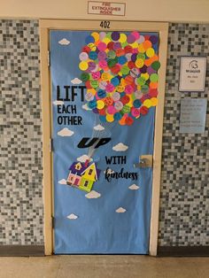 a door decorated with balloons and the words lift each other