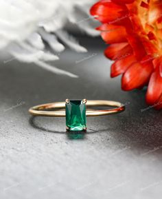 This vintage-inspired engagement ring is a true testament to timeless elegance, crafted with meticulous detail in 14K gold. The ring features a stunning emerald, creating a captivating focal point that symbolizes renewal and enduring love. The incorporation of sterling silver complements the vintage aesthetic, while the low-profile solitaire setting adds a touch of sophistication and subtlety. Designed for various occasions, from engagements to weddings, anniversaries, promises, or as a birthstone ring, this piece is versatile and meaningful. The incorporation of the emerald not only adds a pop of color but also carries significance as a birthstone for those born in May or as a symbol of rebirth and loyalty. Available Birthstones: *January (Garnet): A deep red gemstone symbolizing friendsh Emerald Bezel Setting Ring For Wedding, Timeless Solitaire Emerald Promise Ring, Heirloom Emerald Cut Green Wedding Ring, Classic Green Jewelry For Promise Occasions, Emerald Cut Emerald Ring With Bezel Setting For Promise, Timeless Emerald Wedding Ring For May Birthstone, Solitaire Emerald Cut Emerald Promise Ring, Dainty Solitaire Emerald Cut Emerald Ring, Classic Emerald Solitaire Rings