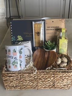 a wicker basket filled with coffee, books and other items