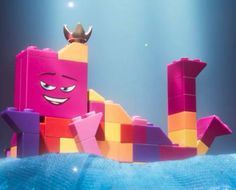 the lego movie character is wearing a crown