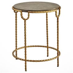 an iron and marble side table with gold trimmings on the top, against a white background