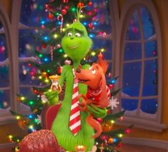 the grinch christmas tree is decorated with lights