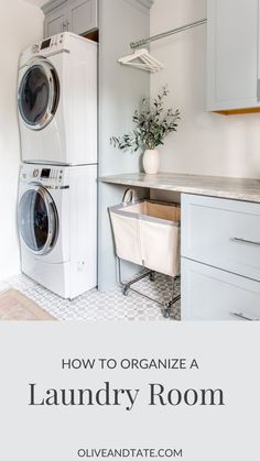 a washer and dryer sitting in a kitchen next to each other on top of cabinets