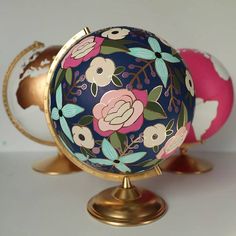 two decorative globes sitting on top of each other