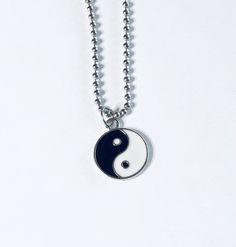 "Yin & Yang necklace, Yin and Yang necklace, unisex black and white with silver charm, on a ball chain necklace which is STAINLESS STEEL. Boho chic bohemian. Occult esoteric jewelry 💕 Yin & Yang is a concept of dualism with its roots in Taoism/ philosophy. The Yin or dark side is associated with shadows, femininity & the trough of a wave, the Yang or light side represents brightness, passion & growth, both sides present duality, both sides work together. *this is a super cute ne Trendy Black Sterling Silver Necklace, Symbolic Black Necklace With Adjustable Chain, Symbolic Black Jewelry With Adjustable Chain, Black Symbolic Jewelry With Adjustable Chain, Black Clavicle Chain Charm Necklace, Adjustable Hypoallergenic Black Necklace, Symbolic Black Stainless Steel Necklace, Trendy Black Nickel-free Necklace, Hypoallergenic Black Stainless Steel Necklace