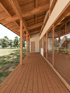 an empty wooden porch with sliding glass doors