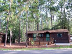 a cabin in the woods with lots of trees