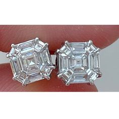 A stunning pair of 2.88 carats total F/G color, VVS/VS quality Diamond studs, set in solid 18K White Gold. The earrings look like 5 carat each square emerald cut diamonds. The pressure setting of baguettes and trapezoids are of top quality, and the earrings come with push-pull backing. We provide free shipping, and accept returns. Please feel free to message us for more information. Quality Diamonds, Diamond Studs, Jewelry Earrings Studs, Emerald, Jewelry Earrings, White Gold, Stud Earrings, Stone, Gold