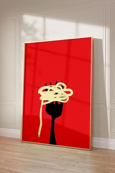 a red poster with spaghetti on it in an empty room