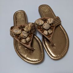 New Without Tags, Vince Camuto Copper/Bronze Leather Upper Sandals With Jewel And Stone Detail, In Women's Size 8.5. These Are Beautiful, Well Made Sandals That Are Unworn, But Have Slight Blemishes To The Footbed, Which Are Not Noticeable While Being Worn, See Pictures. Casual Gold Flip Flops With Flat Heel, Casual Gold Flat Heel Flip Flops, Gold Leather Flip Flops For Summer, Casual Closed Toe Gold Flip Flops, Casual Gold Closed Toe Flip Flops, Gold Leather Flat Flip Flops, Gold Cushioned Flip Flops For Spring, Gold Open Toe Synthetic Flip Flops, Gold Slip-on Synthetic Sandals