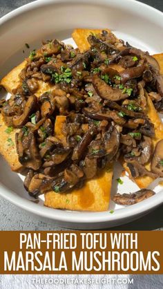 pan fried tofu with masala mushrooms in a white bowl