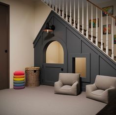 a room with two chairs and a dog house on the floor next to a stair case