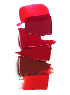 red lipstick is stacked on top of each other in the shape of a rectangle