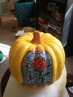 a yellow pumpkin with a stained glass design on it