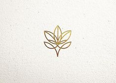 a gold leaf on a white background