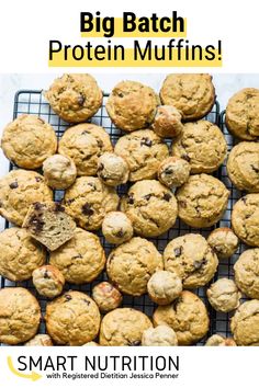 a bunch of muffins sitting on top of a cooling rack with the words, big batch protein muffins