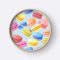 a clock with colorful macaroons on it