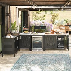 an outdoor kitchen with lots of counter space