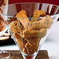 two glass bowls filled with dog treats next to each other